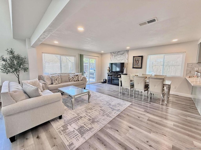 living room with light hardwood / wood-style floors