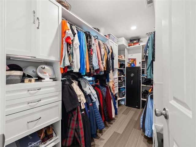 walk in closet featuring light wood-type flooring