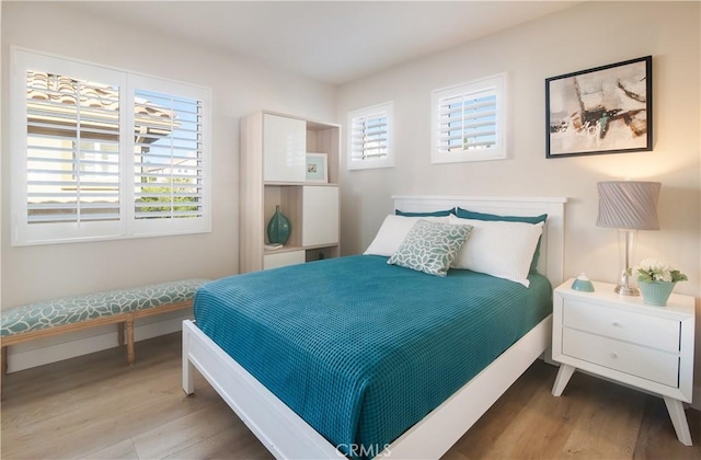 bedroom featuring hardwood / wood-style floors