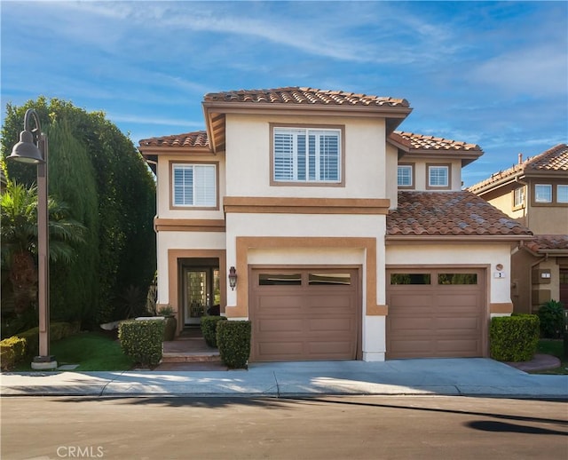 mediterranean / spanish-style house featuring a garage