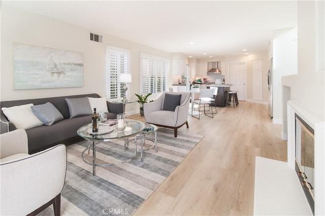 living room with light hardwood / wood-style floors