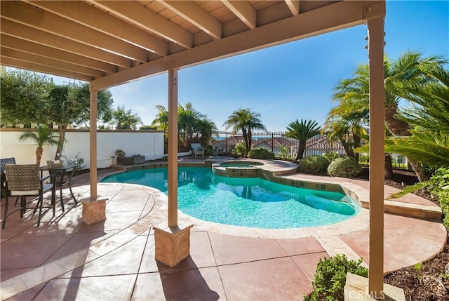 view of swimming pool with an in ground hot tub and a patio area