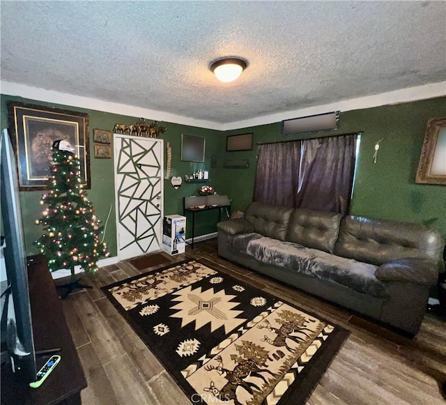 living room with dark hardwood / wood-style flooring and a textured ceiling