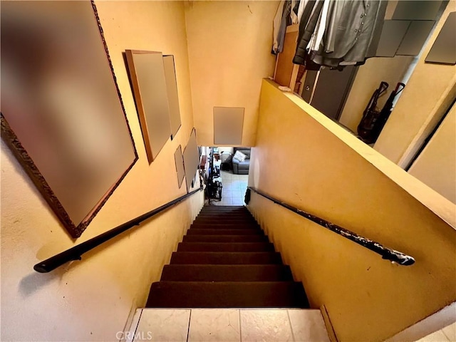 staircase with tile patterned flooring