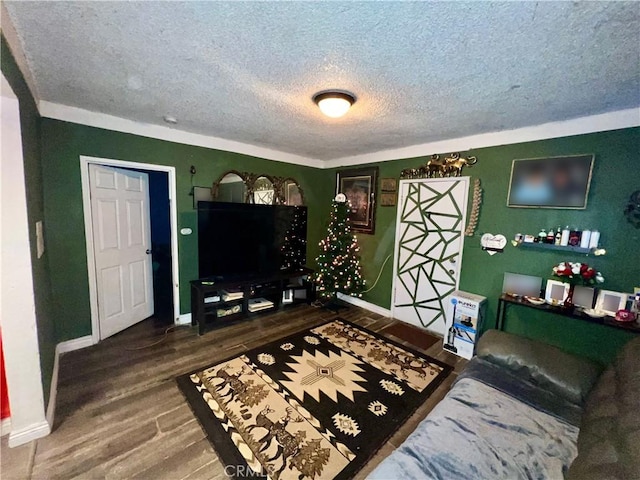 living room featuring dark wood-type flooring and a textured ceiling