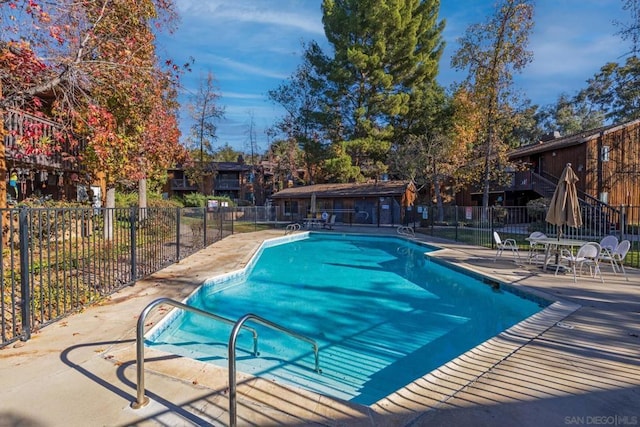 view of swimming pool featuring a patio area