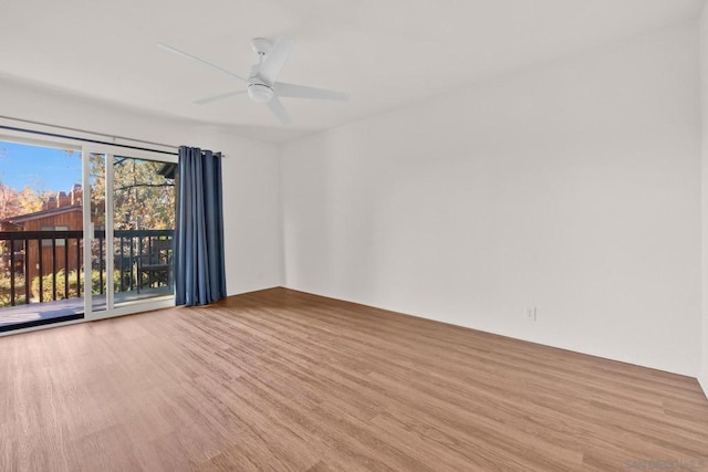 spare room featuring ceiling fan and light hardwood / wood-style floors