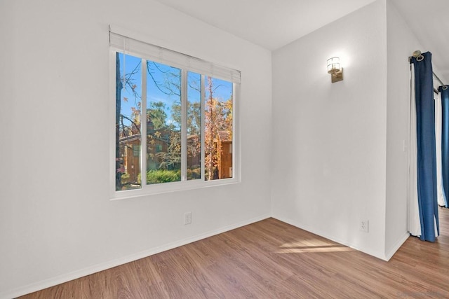 unfurnished room with light hardwood / wood-style flooring