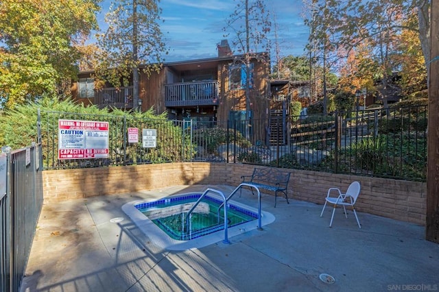 view of pool featuring a community hot tub