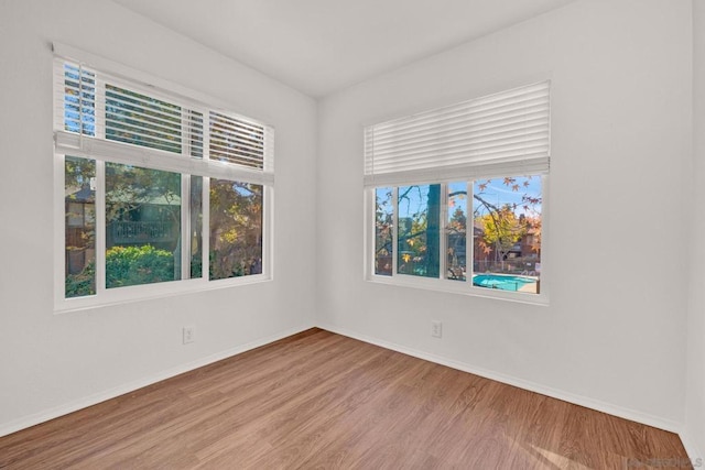 unfurnished room featuring light wood-type flooring