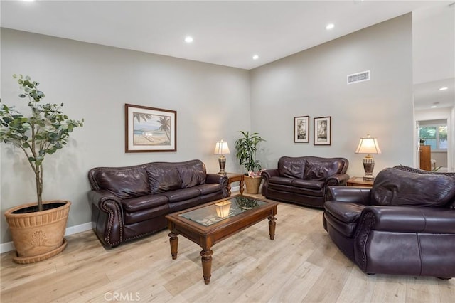 living room with light hardwood / wood-style flooring