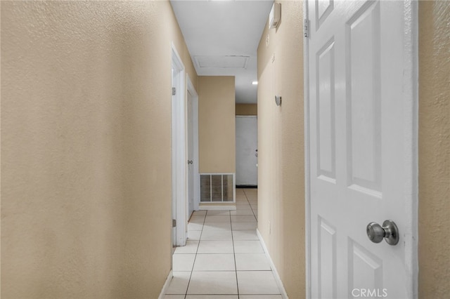 hallway featuring light tile patterned floors