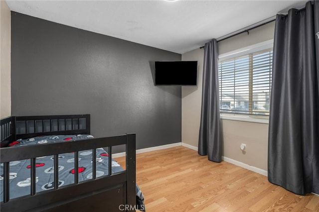 bedroom featuring light hardwood / wood-style floors