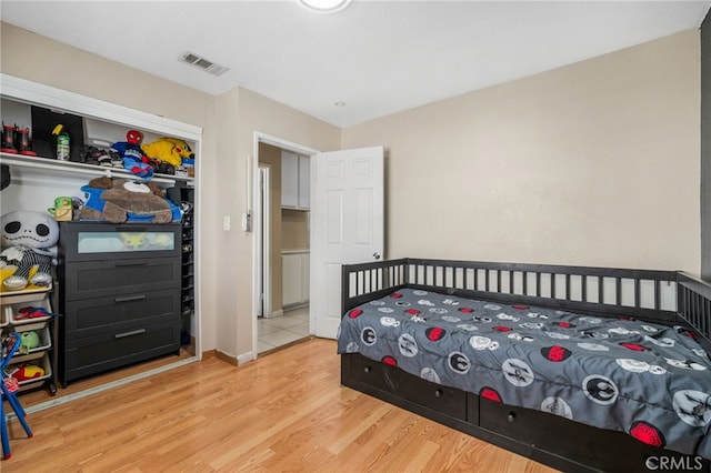 bedroom featuring light wood-type flooring