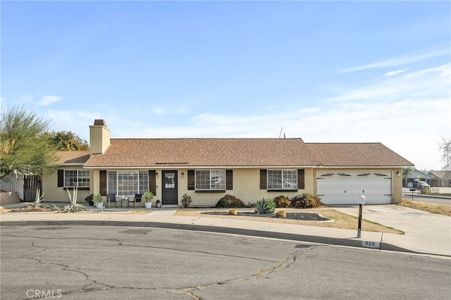 ranch-style home with a garage