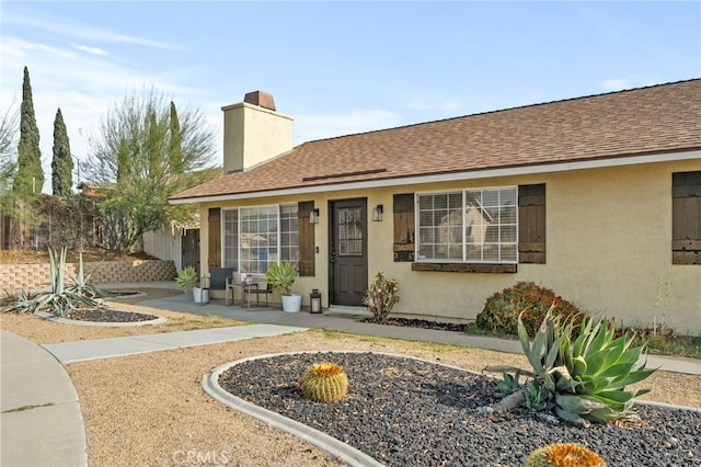 ranch-style home with a patio