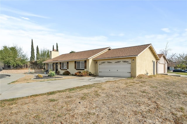 ranch-style home featuring a garage