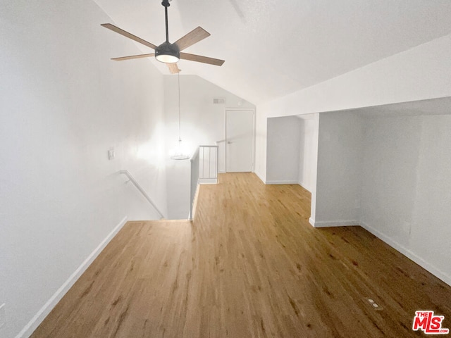 bonus room with ceiling fan, lofted ceiling, and light hardwood / wood-style flooring