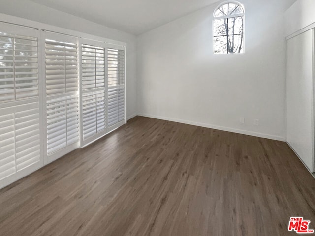 unfurnished dining area featuring dark hardwood / wood-style floors