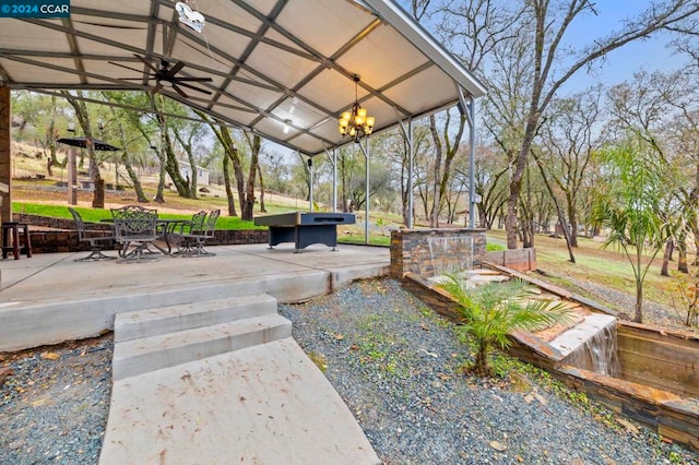 view of patio featuring ceiling fan