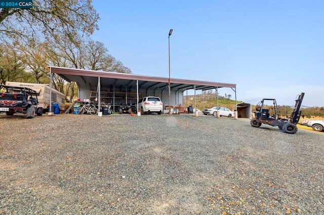 view of parking / parking lot with a carport