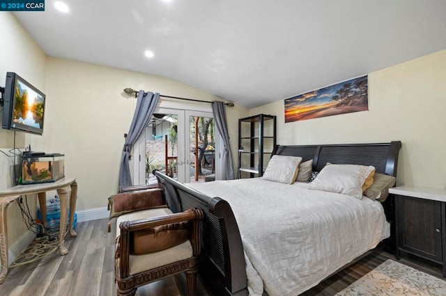 bedroom featuring access to exterior, french doors, vaulted ceiling, and hardwood / wood-style flooring