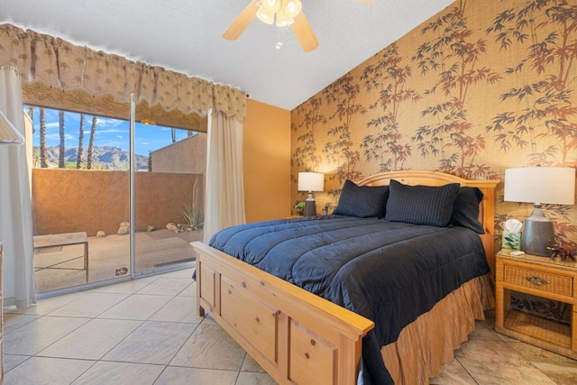 bedroom featuring ceiling fan, light tile patterned floors, access to exterior, and lofted ceiling