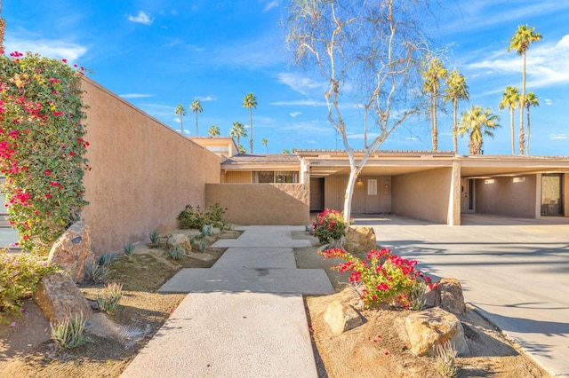 view of front of property with a carport