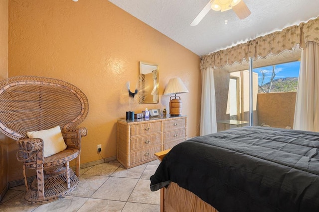 bedroom with light tile patterned flooring, ceiling fan, access to exterior, and lofted ceiling