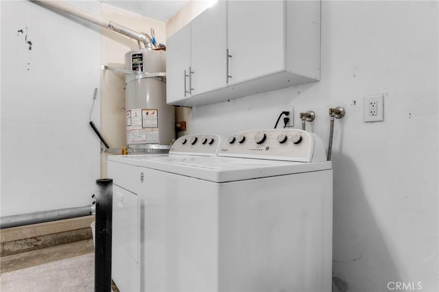 laundry room with washer and clothes dryer, strapped water heater, and cabinets