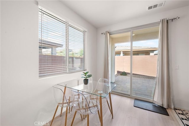 dining area with light hardwood / wood-style flooring