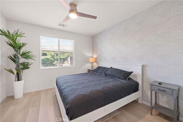 bedroom featuring ceiling fan and light hardwood / wood-style floors