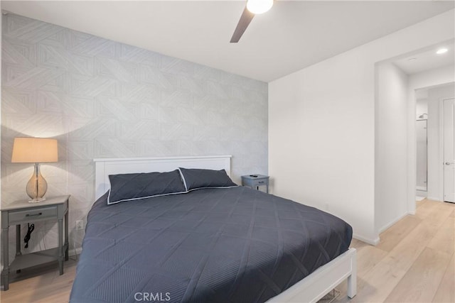 bedroom with hardwood / wood-style flooring and ceiling fan