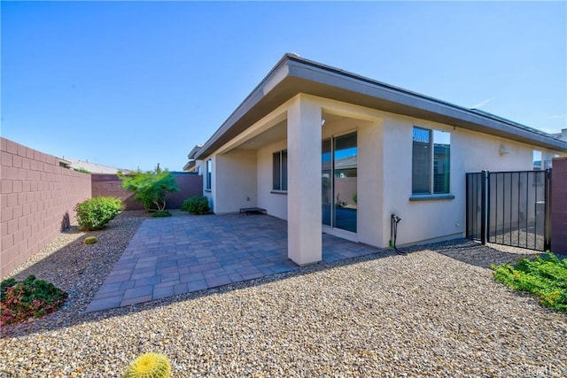 rear view of house with a patio