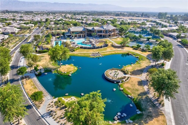 drone / aerial view with a water and mountain view