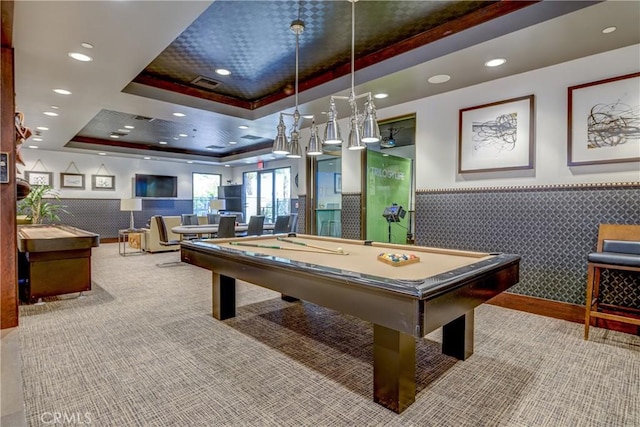 game room with pool table, a raised ceiling, and carpet