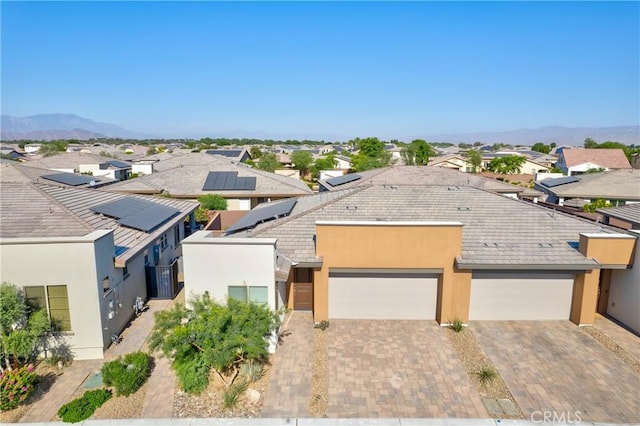 birds eye view of property featuring a mountain view