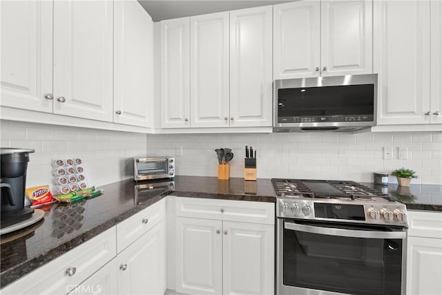 kitchen with appliances with stainless steel finishes and white cabinets