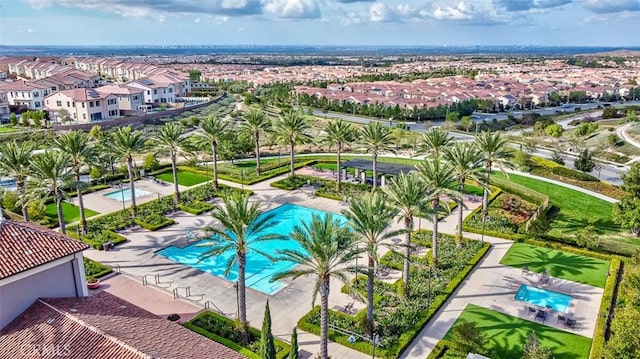 view of swimming pool with a residential view