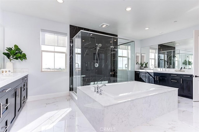 bathroom featuring marble finish floor, a marble finish shower, vanity, baseboards, and a bath