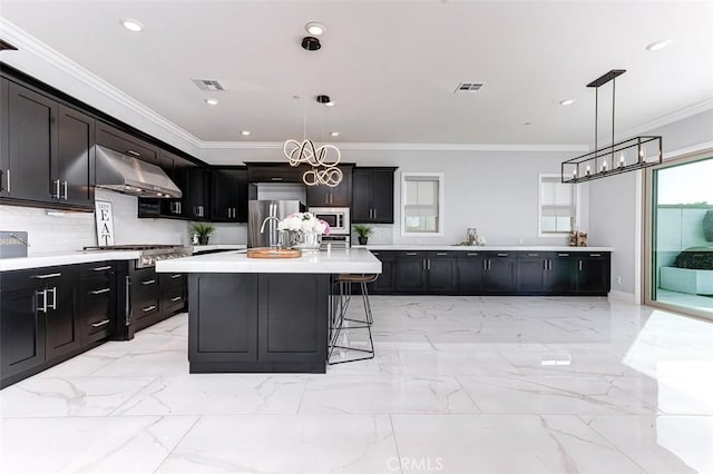 kitchen featuring visible vents, appliances with stainless steel finishes, marble finish floor, light countertops, and under cabinet range hood