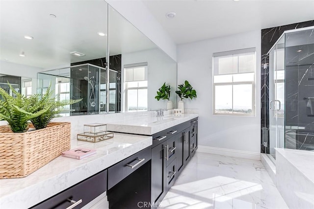 full bath with marble finish floor, vanity, baseboards, and a stall shower