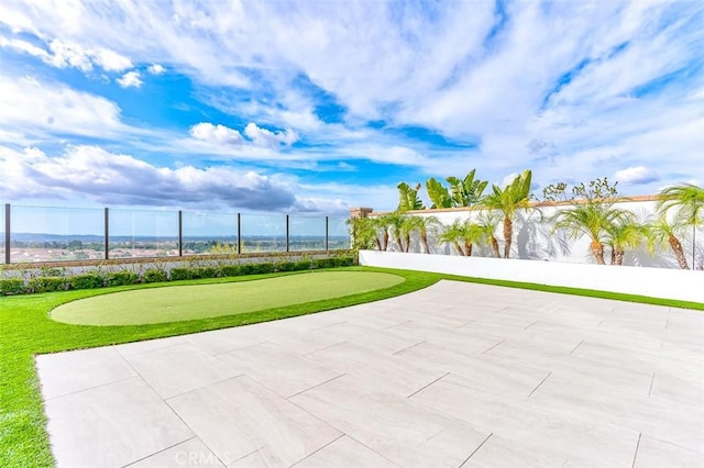 surrounding community featuring a patio area and fence