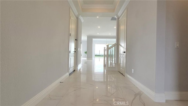 hall with baseboards, marble finish floor, and crown molding