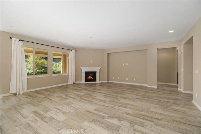 unfurnished living room with light hardwood / wood-style floors