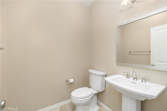 bathroom with sink and toilet
