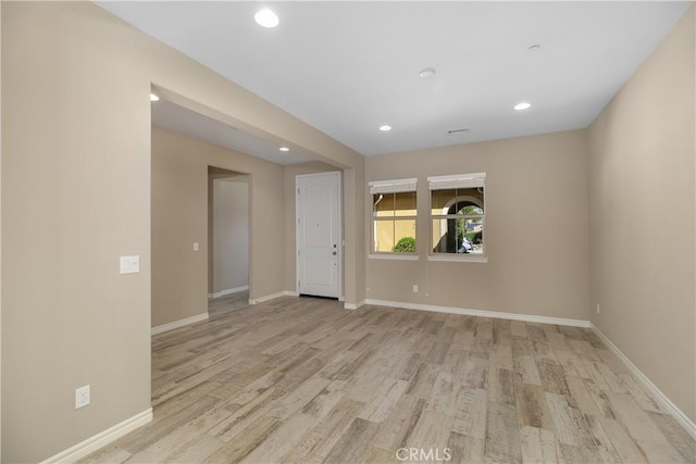 spare room with light wood-type flooring