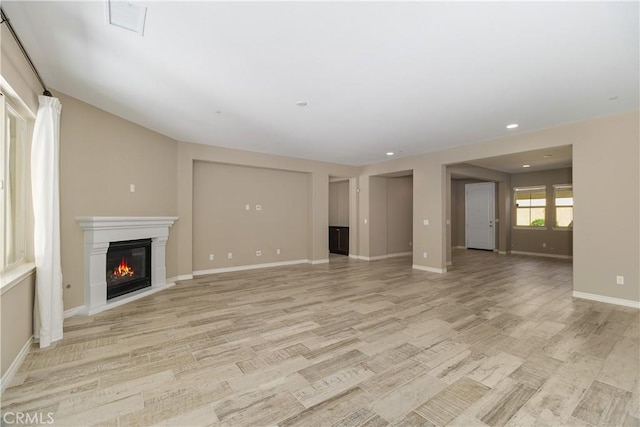 unfurnished living room with light wood-type flooring