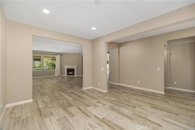 unfurnished living room with light hardwood / wood-style floors