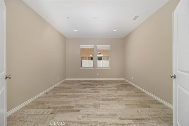 unfurnished room featuring light hardwood / wood-style flooring